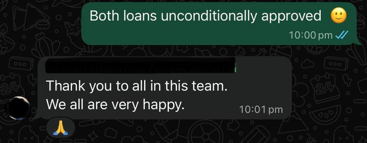WhatsApp message confirming both loans unconditionally approved
